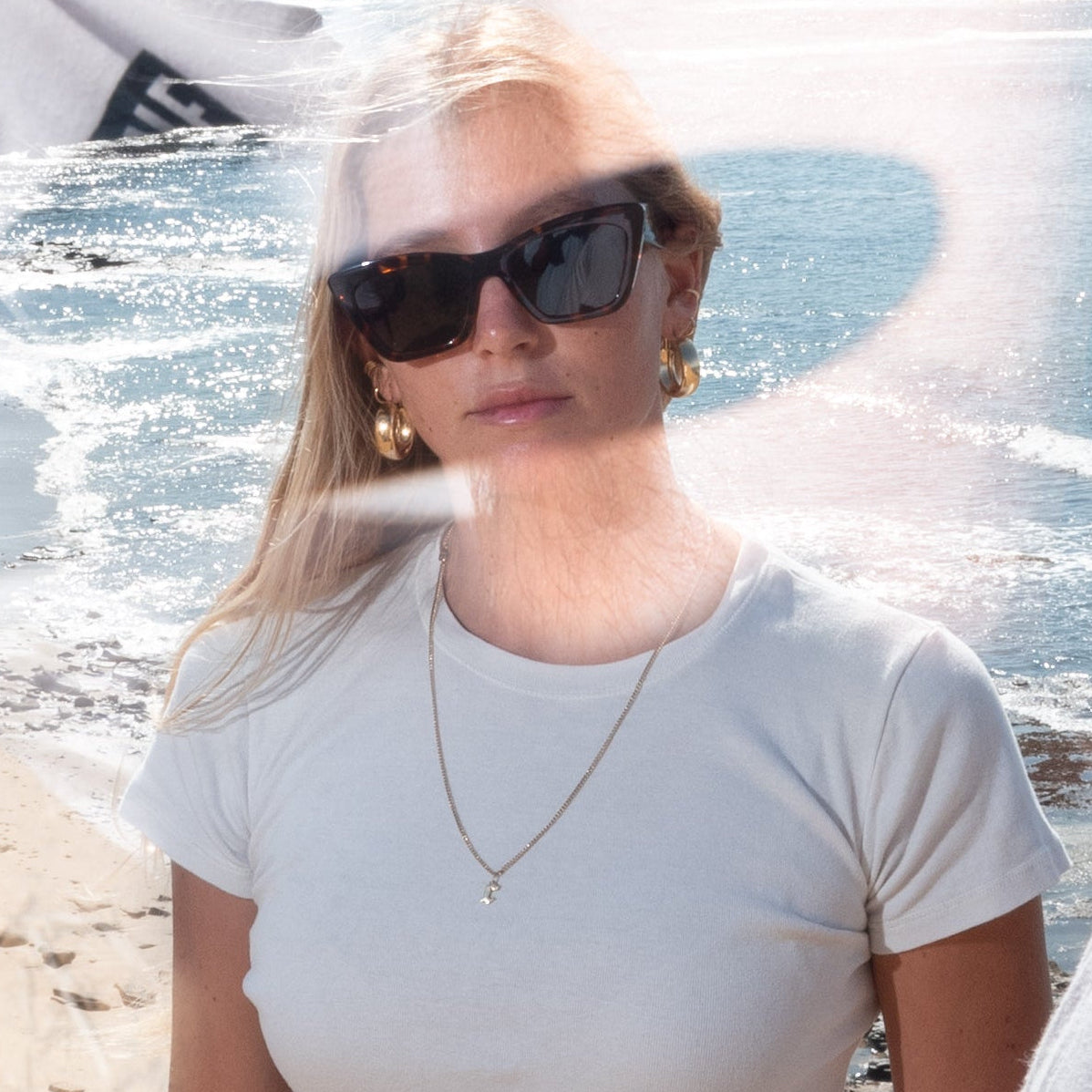 woman in sunglasses at the beach
