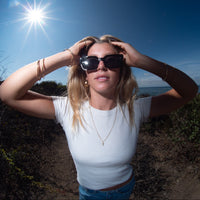 Person in sunglasses taking with a scenic background