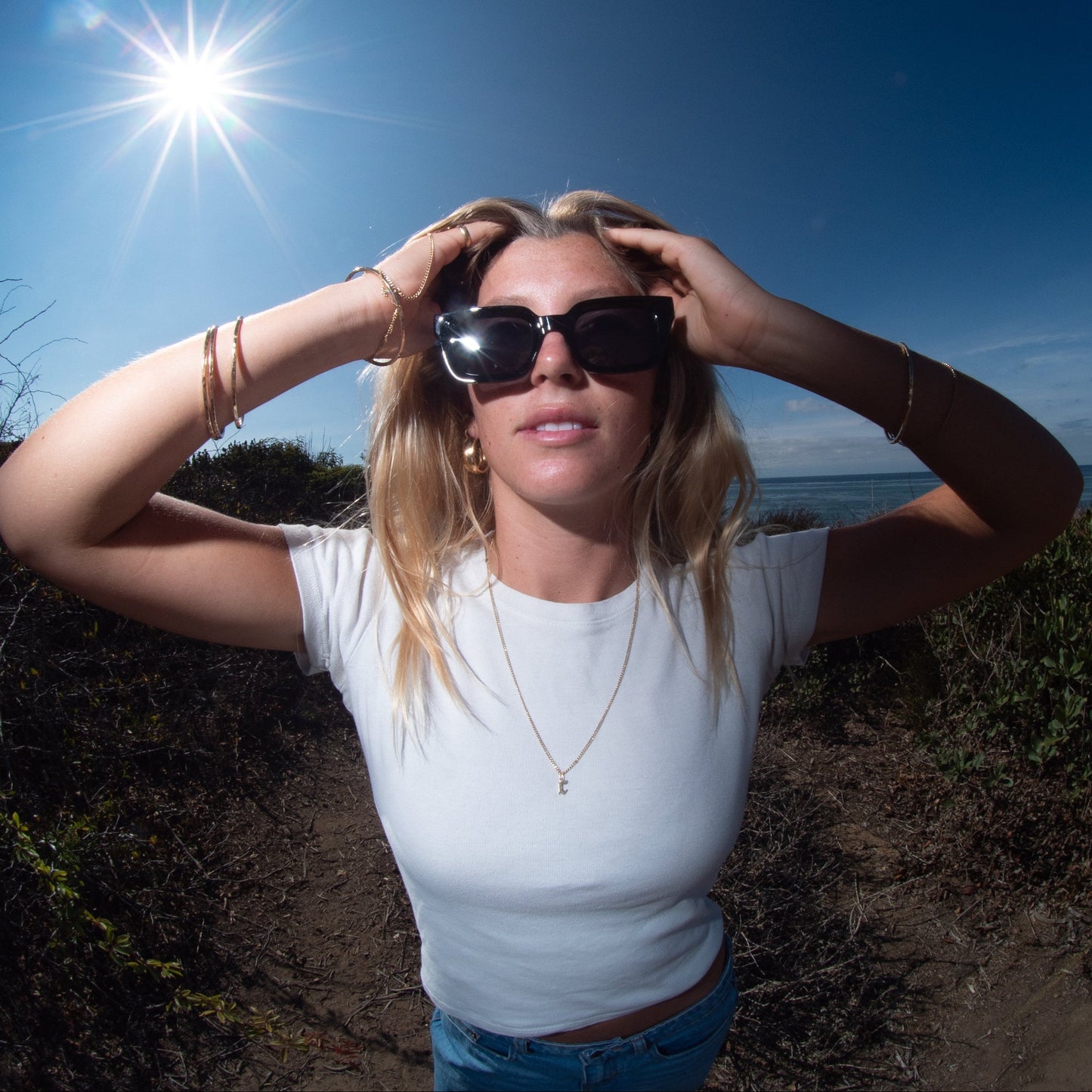 Person in sunglasses taking with a scenic background